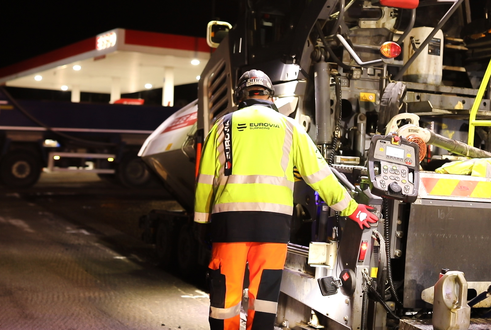 Eurovia Highways worker operating surfacing machine