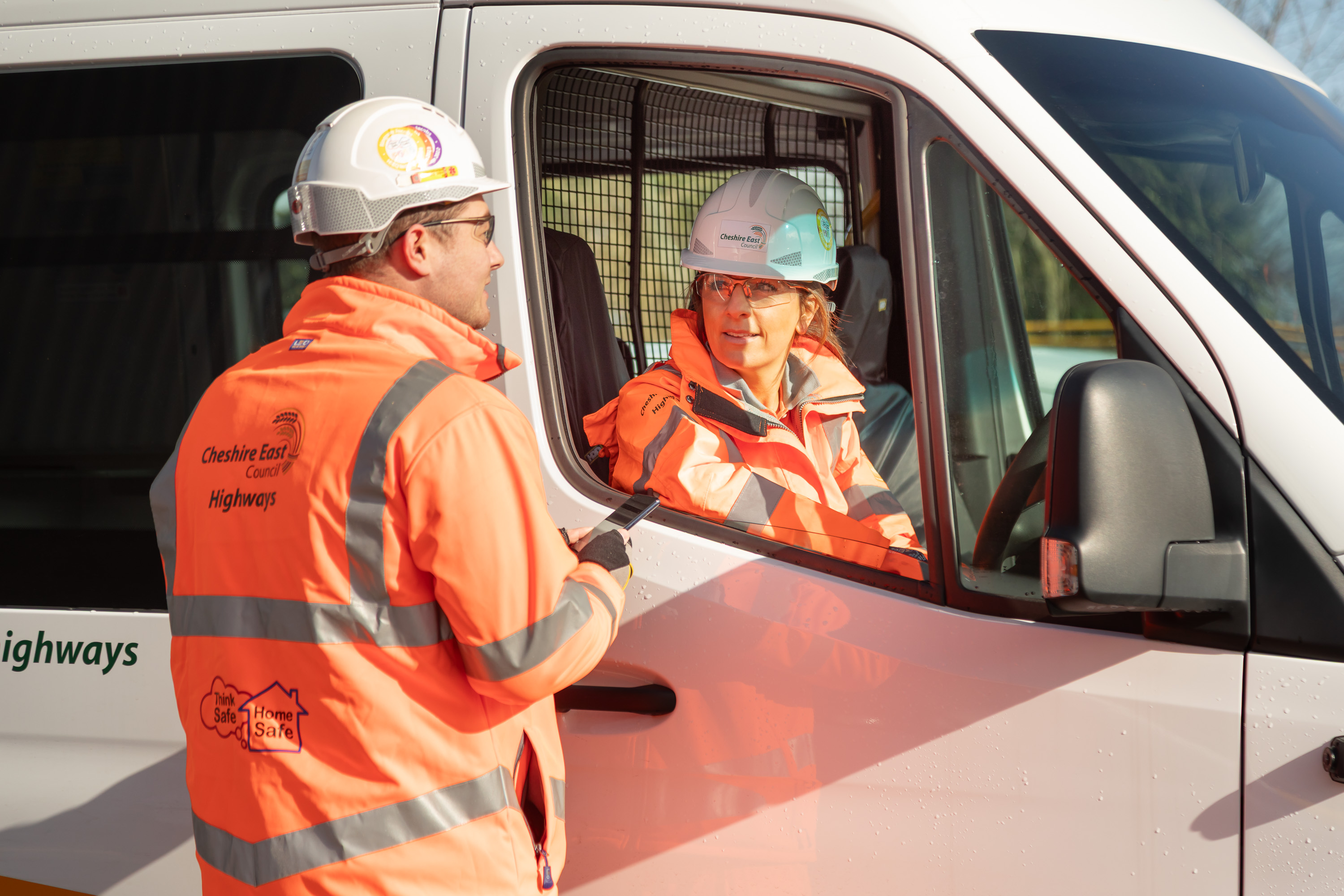 Ringway Jacobs highways operative speaking with colleague seated in welfare vehicle during on-site coordination