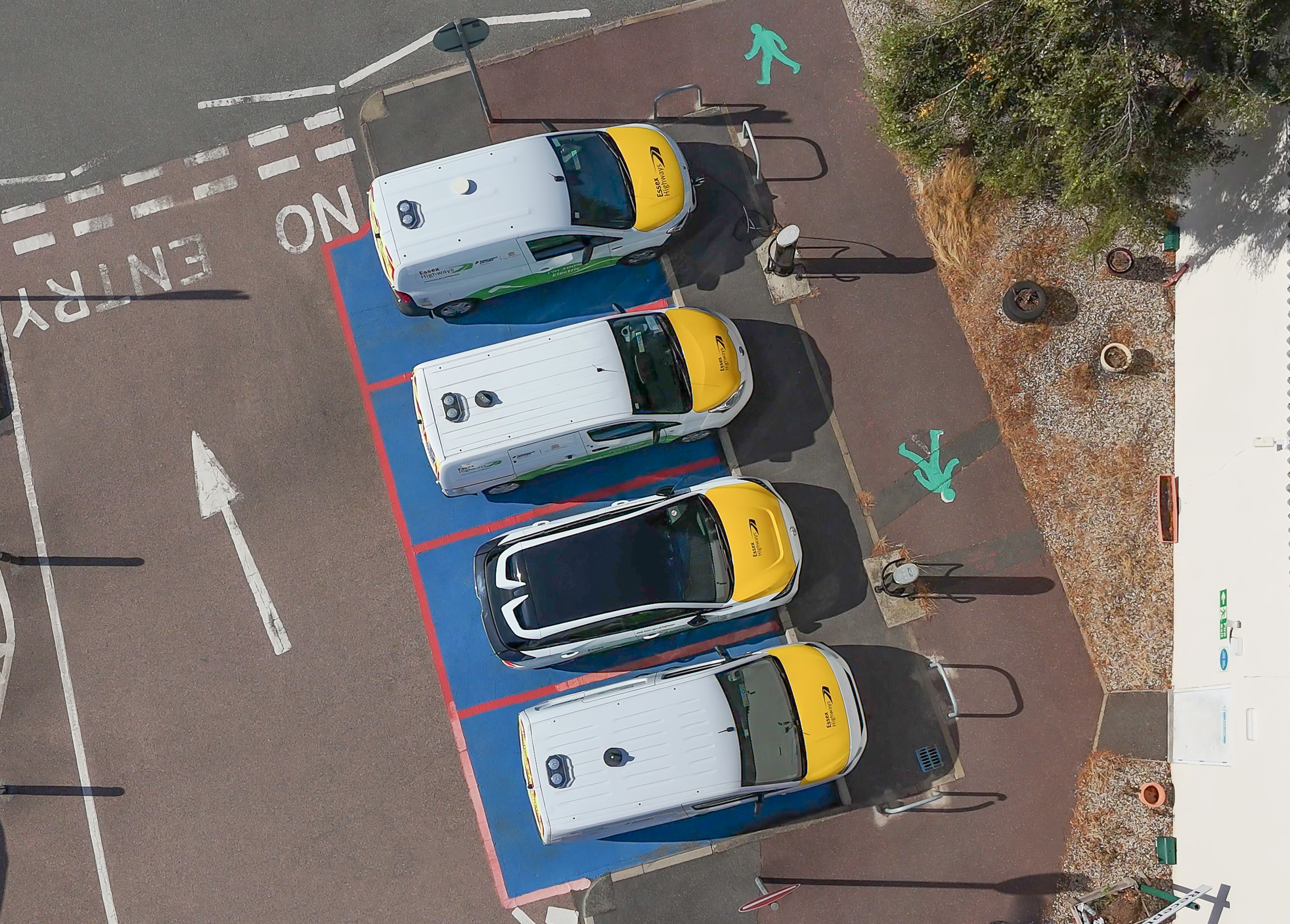 Aerial view of electric vehicles positioned on marked roadway illustrating low-emission transport at Ringway Jacobs head office