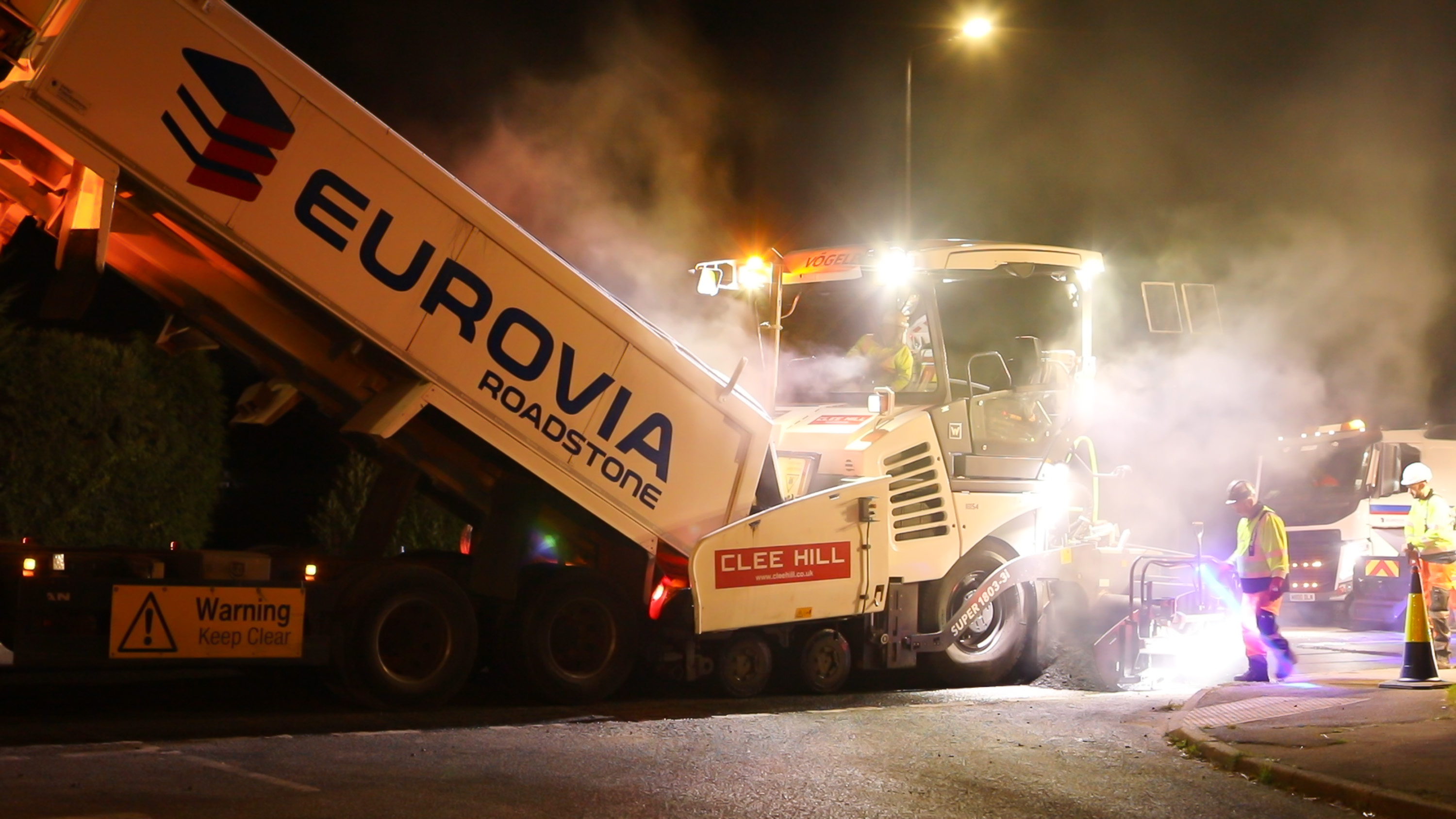 Road surfacing works carried out at night using EUROVIA roadstone machinery as part of Ringway Jacobs’ supply chain operations.
