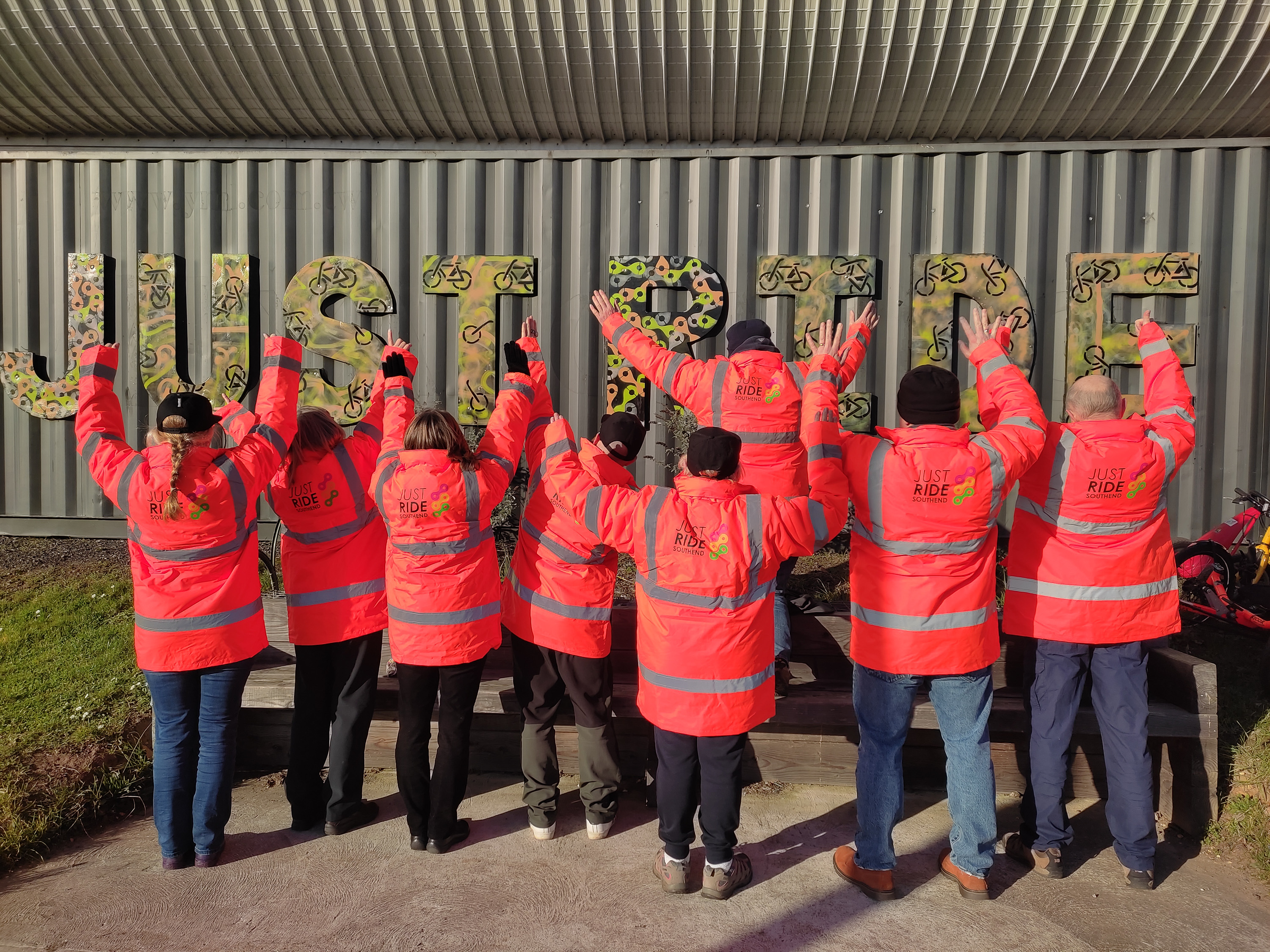Group of people Ringway wearing high-visibility clothing celebrating community engagement initiative